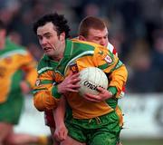 11 February 2001; Damien Diver of Donegal is tackled by Owen Mulligan of Tyrone during the Allianz National Football League Division 1B match between Tyrone and Donegal at Healy Park in Omagh, Tyrone. Photo by Damien Eagers/Sportsfile