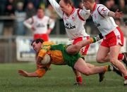 11 February 2001; Tony Boyle of Donegal in action against Peter Canavan and Kevin Hughes of Tyrone during the Allianz National Football League Division 1B match between Tyrone and Donegal at Healy Park in Omagh, Tyrone. Photo by Damien Eagers/Sportsfile