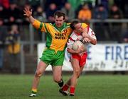 11 February 2001; Pascal Canavan of Tyrone is tackled by Tony Boyle of Donegal during the Allianz National Football League Division 1B match between Tyrone and Donegal at Healy Park in Omagh, Tyrone. Photo by Damien Eagers/Sportsfile