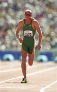 22 September 2000; Paul Brizzel of Ireland during his heat of the Men's 100m at Stadium Australia in Sydney Olympic Park in Sydney, Australia. Photo by Brendan Moran/Sportsfile