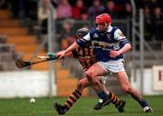 11 February 2001; DJ Carey of Kilkenny in action against Joe Phelan of Laois during the Allianz National Hurling League Division 1B Round 2 match between Kilkenny and Laois at Nowlan Park in Kilkenny. Photo by David Maher/Sportsfile