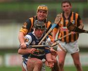 11 February 2001; David Cuddy of Laois is put under pressure from Canice Brennan of Kilkenny during the Allianz National Hurling League Division 1B Round 2 match between Kilkenny and Laois at Nowlan Park in Kilkenny. Photo by David Maher/Sportsfile