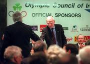 15 February 2001; President of the Olympic Council of Ireland Pat Hickey, right, shakes hands with the defeated challenger Richard Burrows after the election for position of President during the Olympic Council of Ireland Annual General Meeting at Jury's Hotel in Dublin. Photo by Brendan Moran/Sportsfile