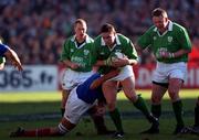 17 February 2001; David Wallace of Ireland is tackled by Abdelatif Benazzi of France during the Lloyds TSB Six Nations Rugby Championship match between Ireland and France at Lansdowne Road in Dublin. Photo by Matt Browne/Sportsfile