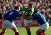 17 February 2001; Ronan O'Gara of Ireland is tackled by Olivier Magne, left, and Raphael Ibanez of France during the Lloyds TSB Six Nations Rugby Championship match between Ireland and France at Lansdowne Road in Dublin. Photo by Matt Browne/Sportsfile