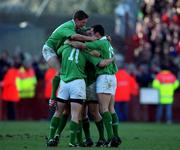 17 February 2001; Ireland players, from left, Ronan O'Gara, Tyrone Howe and Girvan Dempsey celebrate after the Lloyds TSB Six Nations Rugby Championship match between Ireland and France at Lansdowne Road in Dublin. Photo by Matt Browne/Sportsfile