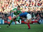 17 February 2001; Brian O'Driscoll of Ireland is tackled by Richard Dourthe of France during the Lloyds TSB Six Nations Rugby Championship match between Ireland and France at Lansdowne Road in Dublin. Photo by Brendan Moran/Sportsfile