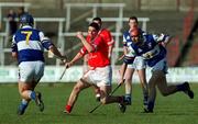 18 February 2001; Neil Ronan of Cork in action against Robert Delaney, left, and Joe Phelan of Laois during the Allianz National Hurling League Division 1B match between Laois and Cork at O'Moore Park in Portlaoise, Laois. Photo by Brendan Moran/Sportsfile