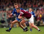 18 February 2001; Colm Reilly of Crossmolina Deel Rovers is tackled by Gavin Diamond of Bellaghy Wolfe Tones during the AIB All-Ireland Senior Club Football Championship Semi-Final match between Crossmolina Deel Rovers v Bellaghy Wolfe Tones at Brewster Park in Enniskillen, Fermanagh. Photo by Ray McManus/Sportsfile