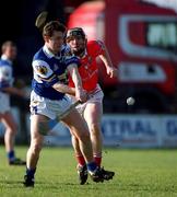 18 February 2001; Des Conroy of Laois in action against Wayne Sherlock of Cork during the Allianz National Hurling League Division 1B match between Laois and Cork at O'Moore Park in Portlaoise, Laois. Photo by Brendan Moran/Sportsfile