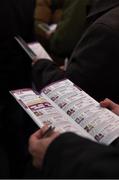 28 December 2015; A punter prepares to mark his race card before racing. Leopardstown Christmas Racing Festival, Leopardstown Racecourse, Dublin. Picture credit: Ray McManus / SPORTSFILE