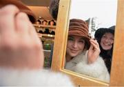 29 December 2015; Racegoers Alanna Rinas, front, and Shara Smith, from Edmonton, Canada, try on hats at the races. Leopardstown Christmas Racing Festival, Leopardstown Racecourse, Dublin. Picture credit: Cody Glenn / SPORTSFILE