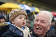 29 December 2015; Racegoers Liam Downey, age 19 months and his grandfather Mick Mahoney, from Bray, cheer on the horses at the races. Leopardstown Christmas Racing Festival, Leopardstown Racecourse, Dublin. Picture credit: Cody Glenn / SPORTSFILE