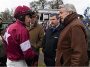 29 December 2015; Jockey Bryan Cooper talks to, from left, Eddie O'Leary of the Gigginstown House Stud, trainer, Gordon Elliott and Michael O'Leary of the Gigginstown House Stud after No More Heroes won the Neville Hotels Novice Steeplechase. Leopardstown Christmas Racing Festival, Leopardstown Racecourse, Dublin. Picture credit: Brendan Moran / SPORTSFILE