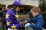 29 December 2015; Jockey Ruby Walsh signs an autograph for Tom Hogan, age 9, from Sandycove, Co. Dublin at the races. Leopardstown Christmas Racing Festival, Leopardstown Racecourse, Dublin. Picture credit: Cody Glenn / SPORTSFILE