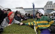 29 December 2015; Jockey Barry Geraghty meets Una Flynn from Mullingar, Co. Westmeath, who lost her husband Dan in June of this year, said she always backs Geraghty in remembrance of her late husband because, &quot;he's a great jockey&quot; after winning the Ryanair E.B.F. Novice Handicap Hurdle on Squouateur. The couple had never missed the racing festival in more than 20 years. Leopardstown Christmas Racing Festival, Leopardstown Racecourse, Dublin. Picture credit: Cody Glenn / SPORTSFILE