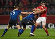 27 December 2015; Lucas Gonzalez Amorosino, Munster, is tackled by Isa Nacewa and Garry Ringrose, 13, Leinster. Guinness PRO12, Round 10, Munster v Leinster. Thomond Park, Limerick. Picture credit: Stephen McCarthy / SPORTSFILE