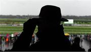 28 December 2015; A racegoer watches the At Races Maiden Hurdle. Leopardstown Christmas Racing Festival, Leopardstown Racecourse, Dublin.  Picture Credit: Ray McManus / SPORTSFILE