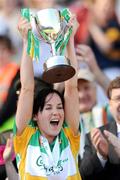 13 September 2009; The Offaly captain Marion Crean lifts the New Ireland Cup. Waterford. Gala All-Ireland Junior Camogie Championship Final, Offaly v Waterford, Croke Park, Dublin. Picture credit: Ray McManus / SPORTSFILE