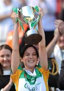 13 September 2009; The Offaly captain Marion Crean lifts the New Ireland Cup. Waterford. Gala All-Ireland Junior Camogie Championship Final, Offaly v Waterford, Croke Park, Dublin. Picture credit: Ray McManus / SPORTSFILE