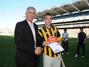13 September 2009; Paddy Hogan, from Danesfort GAA Club, Co. Kilkenny, is presented with his award by Ger Cunningham, Sport Sponsorship Manager, Bord Gais Engergy, after winning the Bord Gáis Energy Crossbar Challenge at half-time in the Bord Gáis Energy GAA Hurling U-21 All-Ireland Championship Final, Clare v Kilkenny. Croke Park, Dublin. Picture credit: Brian Lawless / SPORTSFILE