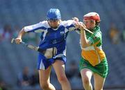 13 September 2009; The Waterford goalkeeper Aisling O'Brien prepares to clear under pressure from Offaly corner-forward Siobhán Flannery. Gala All-Ireland Junior Camogie Championship Final, Offaly v Waterford, Croke Park, Dublin. Picture credit: Ray McManus / SPORTSFILE