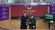26 December 2015; Joe Quinn, left, Integration Manager for Dalata Hotel Group, presents the trophy to J.P. McManus after his horse Coney Island won the Clayton Hotel Maiden Hurdle at the Leopardstown Christmas Racing Festival, Leopardstown Racecourse, Dublin. Picture Credit: Ray McManus / SPORTSFILE