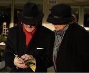 29 December 2015; Racegoers study their race cards. Leopardstown Christmas Racing Festival, Leopardstown Racecourse, Dublin. Picture credit: Cody Glenn / SPORTSFILE