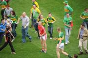 20 September 2009; Cork's Michael Shields is surrounded by celebrating Kerry fans as Kerry's Tommy Walsh makes his way to shake hands. GAA Football All-Ireland Senior Championship Final, Kerry v Cork, Croke Park, Dublin. Picture credit: Brian Lawless / SPORTSFILE