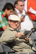 20 September 2009; A supporter reads his programme ahead of the game. GAA Football All-Ireland Senior Championship Final, Kerry v Cork, Croke Park, Dublin. Picture credit: Stephen McCarthy / SPORTSFILE