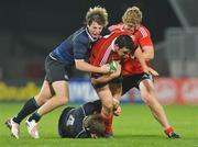 18 September 2009; Patrick Butler, supported by team-mate John Quill, Munster, is tackled by Richard Bent, left, and Cathal Deans, Leinster. U20 Interprovincial, Munster v Leinster, Thomond Park, Limerick. Picture credit: Diarmuid Greene / SPORTSFILE