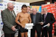 25 September 2009; Poonsawat Kratingdaenggym, of Thailand, weighs in as Promoter Brian Peters, Mel Christle, President of the Boxing Union of Ireland, left, and Tony Lee, Boxing Union of Ireland, second from right, keep a close eye on the scales, during the Hunky Dorys World Title Fight Night Weigh-In, ahead of his WBA World Super Bantamweight title fight against WBA World Super Bantamweight Champion Bernard Dunne. Poonsawat was weighed several times before officials would give confirmation of his official weight. Ballsbridge Inn Hotel, Ballsbridge, Dublin. Picture credit: Brian Lawless / SPORTSFILE