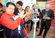 25 September 2009; Poonsawat Kratingdaenggym, of Thailand, has his weight recorded by Tony Lee, Boxing Union of Ireland, right, as Promoter Brian Peters applauds, during the Hunky Dorys World Title Fight Night Weigh-In, ahead of his WBA World Super Bantamweight title fight against WBA World Super Bantamweight Champion Bernard Dunne. Poonsawat was weighed several times before officials would give confirmation of his official weight. Ballsbridge Inn Hotel, Ballsbridge, Dublin. Picture credit: Brian Lawless / SPORTSFILE