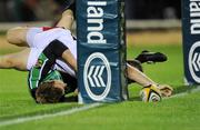 25 September 2009; Darren Cave, Ulster, goes over for a try, despite the tackle of Gavin Duffy, Connacht. Celtic League, Connacht v Ulster, Sportsground, Galway. Picture credit: Matt Browne / SPORTSFILE