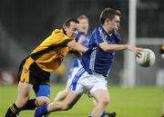 26 September 2009; CJ Gourty, St. Gall's, in action against Paddy Carey, Portglenone Roger Casements. Antrim Senior County Football Final, St. Gall's, Belfast v Portglenone Roger Casements, Casement Park, Belfast. Picture credit: Oliver McVeigh / SPORTSFILE