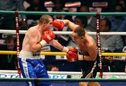 26 September 2009; Anthony Fitzgerald, left, in action against Tadas Jonkus during the fourth round of their International Middleweight bout. Hunky Dorys Fight Night Undercard, The O2, Dublin. Picture credit: Stephen McCarthy / SPORTSFILE