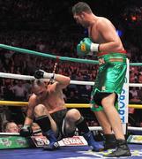 26 September 2009; Tyson Fury, right, knocks down  Tomas Mrazek during the final round during their International Heavyweight bout. Hunky Dorys Fight Night Undercard, The O2, Dublin. Picture credit: David Maher / SPORTSFILE