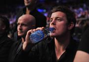 26 September 2009; Ireland rugby captain Brian O'Driscoll watches on during the Bernard Dunne and Poonsawat Kratingdaenggym WBA World Super Bantamweight title fight. Hunky Dorys World Title Fight Night, Bernard Dunne v Poonsawat Kratingdaenggym, The O2, Dublin. Picture credit: David Maher / SPORTSFILE