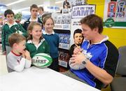 24 September 2009; Andrew Thorne, age 5, Aisling O'Reilly, age 7, and Emma Thorne, age 7, from Glenageary and Ballsbridge, have autographs signed at a Gillette / Tesco In-Store Signing with Brian O'Driscoll, as fans get a close shave with grand slam hero: Gillette Ambassador Brian O’Driscoll takes part in a Tesco in-store signing much to the delight of the large crowd that packed the Dundrum Town Centre store. The in-store signing is part of a Gillette / Tesco promotion which is offering up to 50% off selected Gillette items including the new Gillette Gamer Razor. The rugby legend will now turn his attention to the new rugby season where he attempts to defend the RBS 6 Nations with Ireland and the Heineken Cup European title with Leinster. Gillette / Tesco In-Store Signing with Brian O'Driscoll, Tesco, Dundrum, Co. Dublin. Picture credit: Brendan Moran / SPORTSFILE  *** Local Caption ***