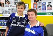 24 September 2009; Jonathan Owens, age 12, from Goatstown, at a Gillette / Tesco In-Store Signing with Brian O'Driscoll, as fans get a close shave with grand slam hero: Gillette Ambassador Brian O’Driscoll takes part in a Tesco in-store signing much to the delight of the large crowd that packed the Dundrum Town Centre store. The in-store signing is part of a Gillette / Tesco promotion which is offering up to 50% off selected Gillette items including the new Gillette Gamer Razor. The rugby legend will now turn his attention to the new rugby season where he attempts to defend the RBS 6 Nations with Ireland and the Heineken Cup European title with Leinster. Gillette / Tesco In-Store Signing with Brian O'Driscoll, Tesco, Dundrum, Co. Dublin. Picture credit: Brendan Moran / SPORTSFILE  *** Local Caption ***