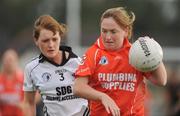 26 September 2009; Maria Donnelly, Clann Eireann, Co. Armagh, in action against Niamh Fahy, Emyvale, Co. Monaghan, during the Senior Championship semi-final. 2009 All-Ireland Ladies Football 7's, Naomh Mearnog, Portmarnock, Dublin. Picture credit: Brendan Moran / SPORTSFILE