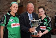 26 September 2009; Ardtrea, Co. Derry, team captains Tracey Kelly, left, and Grace Conway are presented with the Junior Championship trophy by Pat Quill, President, Cumann Peil Gael na mBan. 2009 All-Ireland Ladies Football 7's, Naomh Mearnog, Portmarnock, Dublin. Picture credit: Brendan Moran / SPORTSFILE