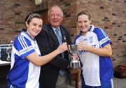 26 September 2009; Galbally, Co Tyrone, team captains Donata McGahan, left, and Coleen Quinn are presented with the Junior Shield by Pat Quill, President, Cumann Peil Gael na mBan. 2009 All-Ireland Ladies Football 7's, Naomh Mearnog, Portmarnock, Dublin. Picture credit: Brendan Moran / SPORTSFILE