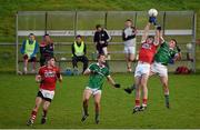 3 January 2016; Peter Kelleher, Cork, contests a kick out with Stephen Cahill, Limerick, as Darragh Treacy, Limerick, and Ian Maguire, Cork, await the dropping ball. McGrath Cup Football, Group B, Round 1, Cork v Limerick. Mallow GAA Grounds, Mallow, Co. Cork. Picture credit: Brendan Moran / SPORTSFILE