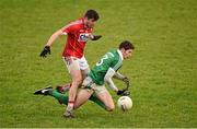 3 January 2016; Sean McSweeney, Limerick, is tackled by Tomás Clancy, Cork. McGrath Cup Football, Group B, Round 1, Cork v Limerick. Mallow GAA Grounds, Mallow, Co. Cork. Picture credit: Brendan Moran / SPORTSFILE