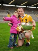 27 September 2009; Clontibret captain Vincent Corey  celebrates with his four year old daughter Clodagh Corey and the Mick Duffy cup after the game. Monaghan County Senior Football Final, Clontibret v Latton, St. Tighearnach's Park, Clones, Co. Monaghan. Photo by Sportsfile
