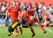 27 September 2009; Denis Fogarty, Munster, is tackled by Martyn Thomas, Newport Gwent Dragons. Celtic League, Munster v Newport Gwent Dragons, Musgrave Park, Cork. Picture credit: Matt Browne / SPORTSFILE
