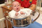 28 September 2009; Jack Mulvihill, from Dublin, sitting in the Brendan Martin Cup during a visit by the winning All-Ireland Cork Ladies Football team to Our Lady's Hospital for Sick Chidren in Crumlin. Crumlin, Co. Dublin. Photo by Sportsfile