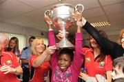 28 September 2009; Stephanie Adebiyi, from Clondalkin, Co. Dublin, lifts the Brendan Martin Cup during a visit by the winning All-Ireland Cork Ladies Football team to Our Lady's Hospital for Sick Chidren in Crumlin. Crumlin, Co. Dublin. Photo by Sportsfile