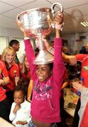 28 September 2009; Stephanie Adebiyi, from Clondalkin, Co. Dublin, lifts the Brendan Martin Cup during a visit by the winning All-Ireland Cork Ladies Football team to Our Lady's Hospital for Sick Chidren in Crumlin. Crumlin, Co. Dublin. Photo by Sportsfile